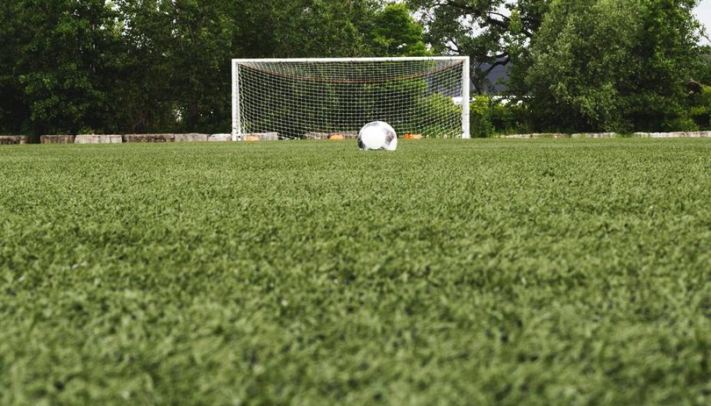 soccer-ball-in-field-with-net
